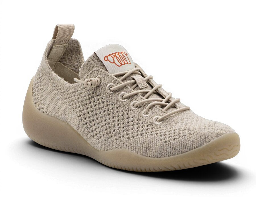 Beige sneaker with brand logo on a white background