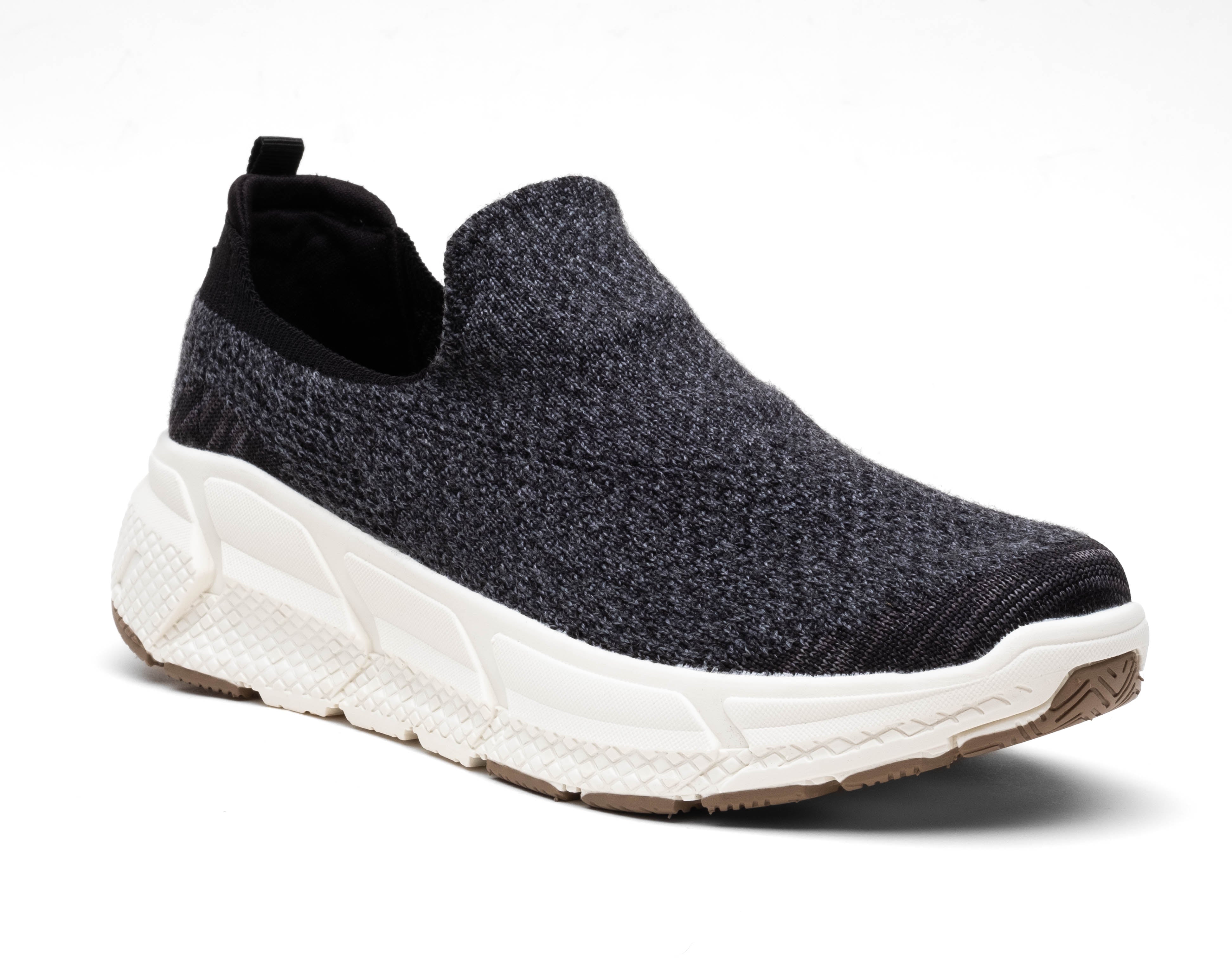 black woolf sneackers shoe three-quarter angle breathable fabric, white sole, and back pull tab for easy wear