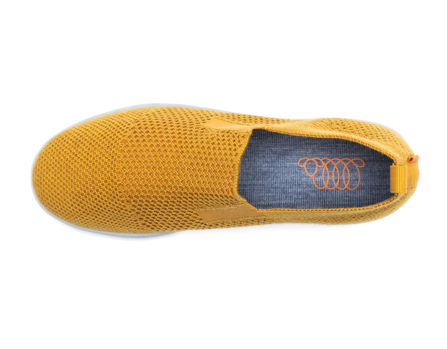 mustard merino wool suffolk with breathable fabric, white sole, and back pull tab for easy wear.